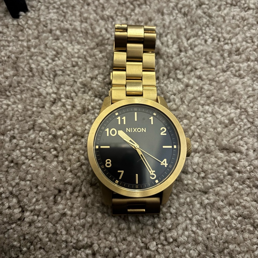 Nixon Gold-Tone Watch with Black Dial